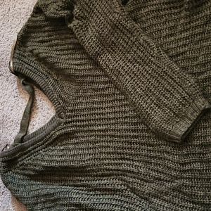 Long sleeve knit sweater.  Dark olive green